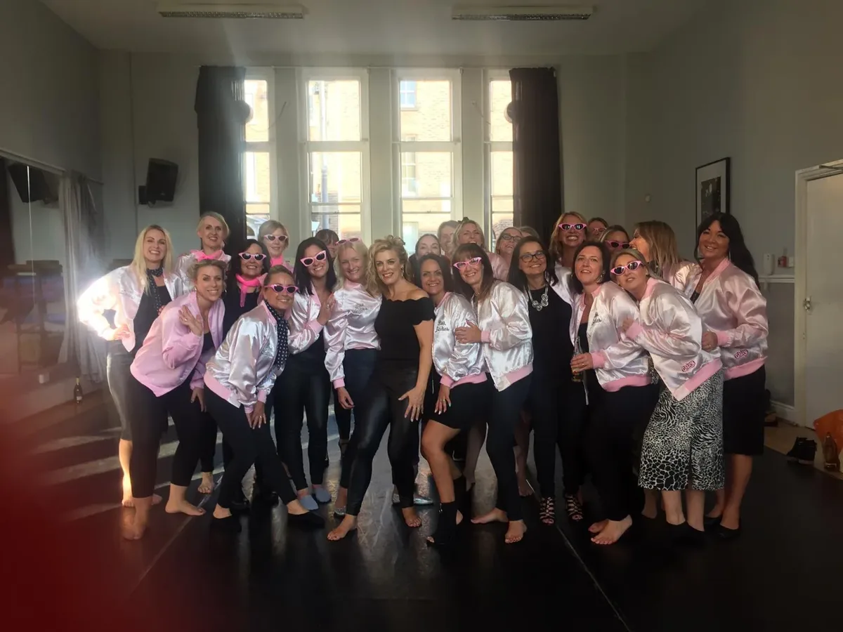 Grease hen party dance class in Leicester holding the finale pose