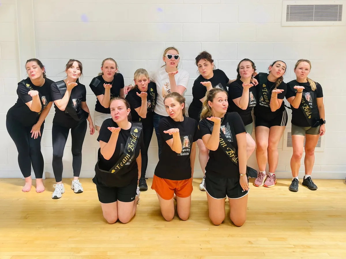 Hen group laughing mid-rehearsal at a Leicester dance class